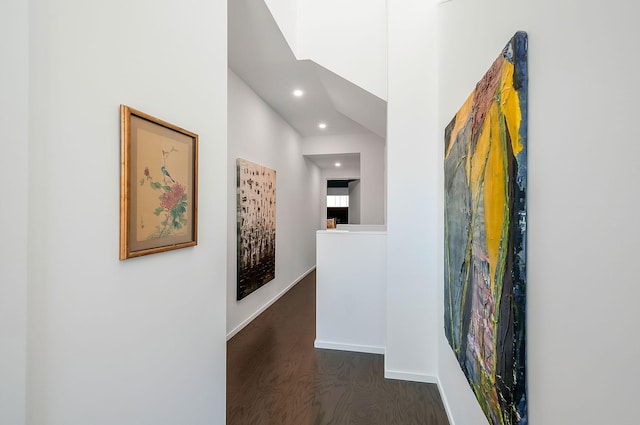 corridor with recessed lighting, wood finished floors, and baseboards