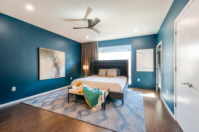 bedroom with a ceiling fan, recessed lighting, wood finished floors, and baseboards