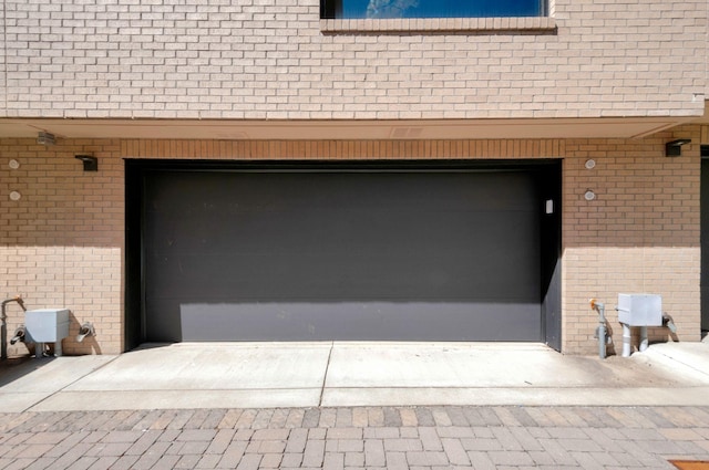 garage featuring driveway