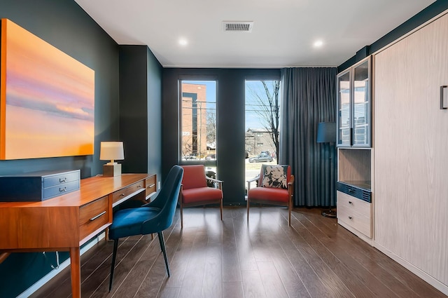 office featuring visible vents and dark wood-style flooring