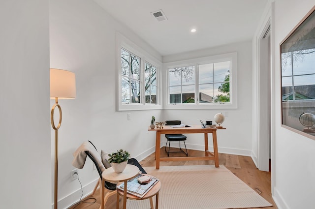 home office with recessed lighting, visible vents, baseboards, and wood finished floors