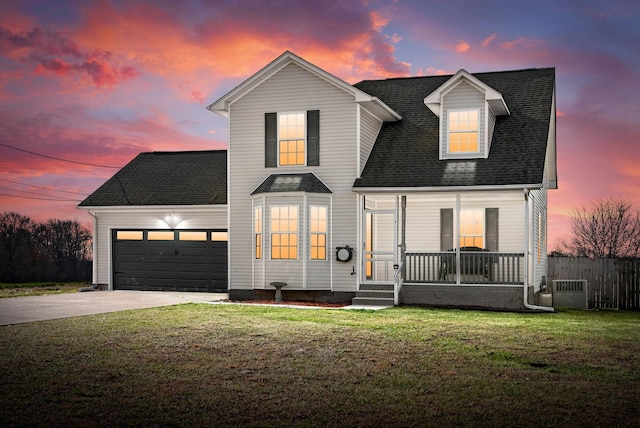 view of front of home with a lawn, a porch, concrete driveway, a shingled roof, and a garage