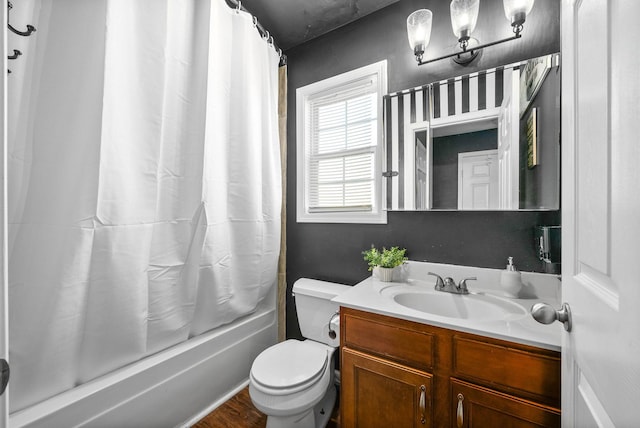 bathroom featuring toilet, vanity, and shower / tub combo