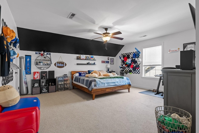 bedroom featuring visible vents, lofted ceiling, and carpet