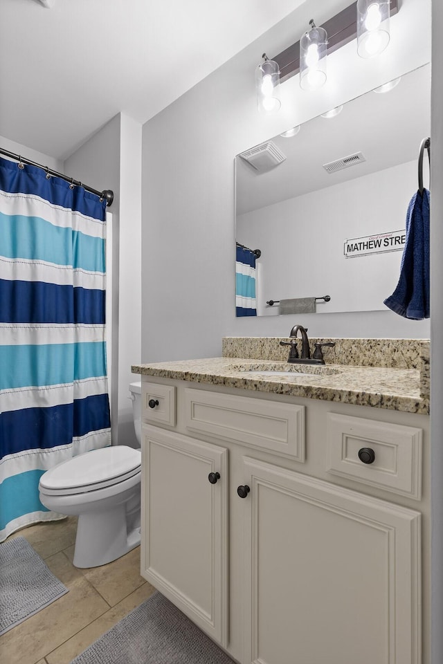 bathroom with visible vents, toilet, vanity, and a shower with shower curtain