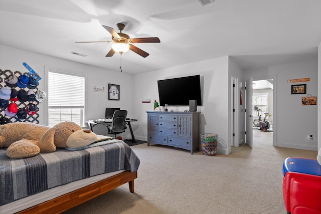 bedroom with visible vents, carpet floors, baseboards, and ceiling fan