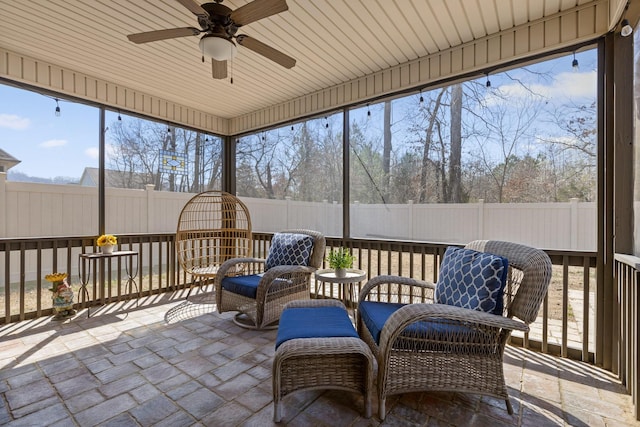 sunroom / solarium with ceiling fan