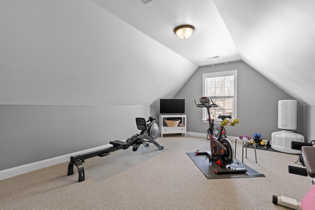 exercise area with baseboards, lofted ceiling, carpet, and visible vents