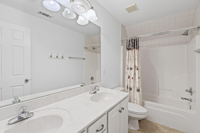 bathroom featuring a sink, visible vents, and toilet