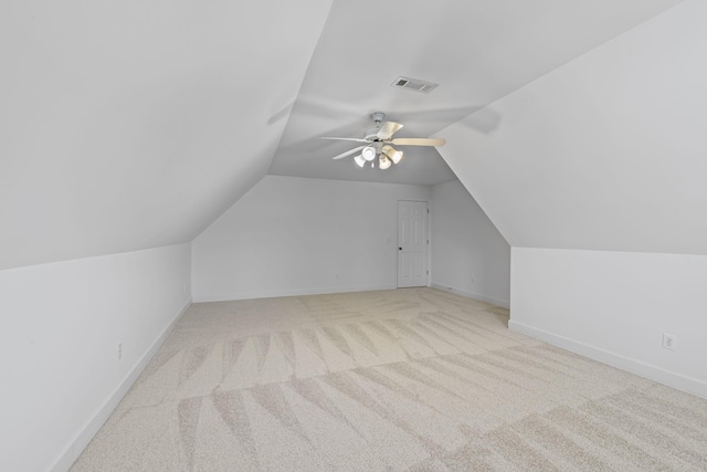 bonus room featuring visible vents, lofted ceiling, baseboards, and a ceiling fan