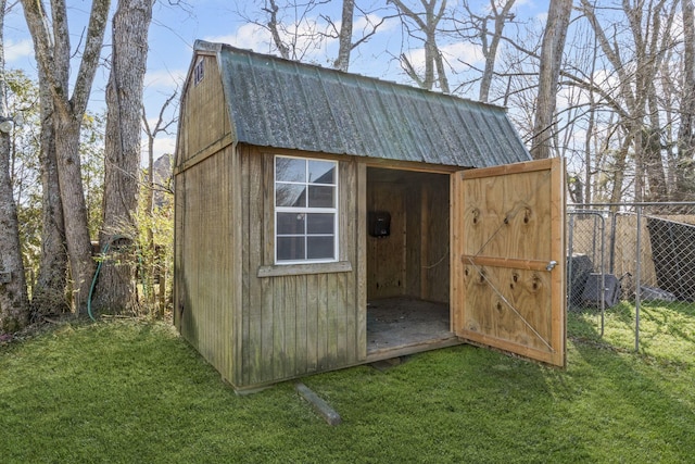 view of shed featuring fence