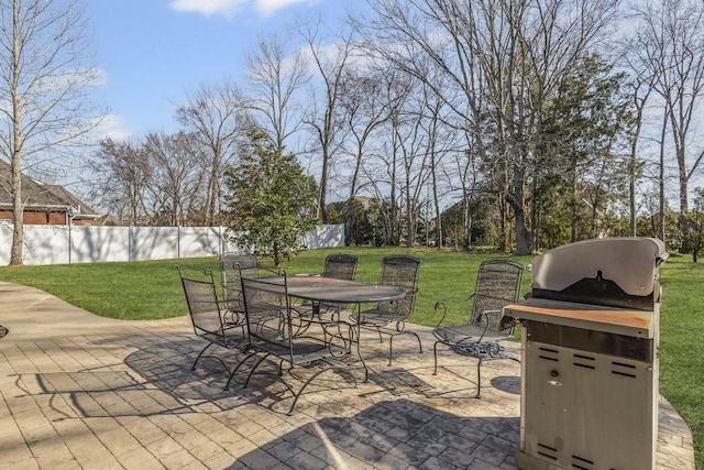 view of patio / terrace with outdoor dining area and fence