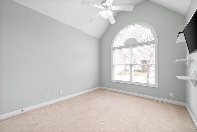 unfurnished room featuring baseboards, light carpet, visible vents, and ceiling fan