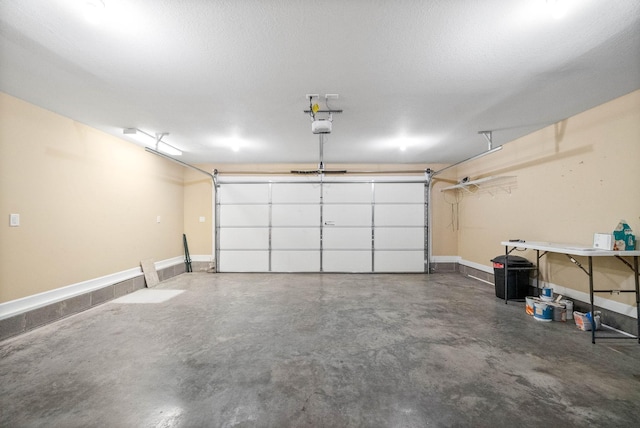 garage featuring baseboards