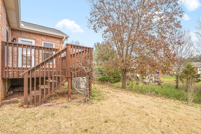 view of yard with a wooden deck