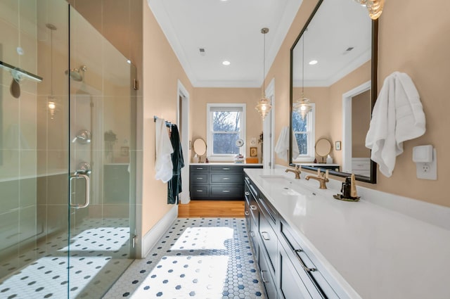 bathroom featuring tile patterned floors, recessed lighting, a shower stall, crown molding, and vanity