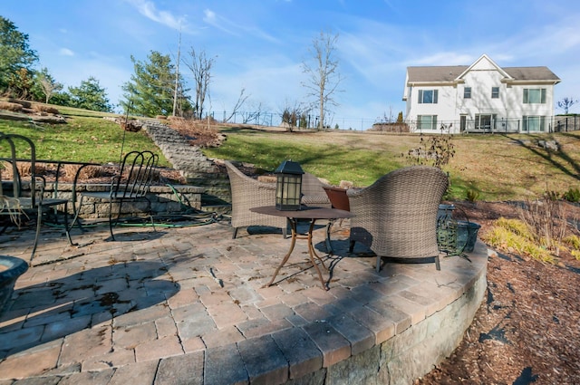 view of patio featuring fence