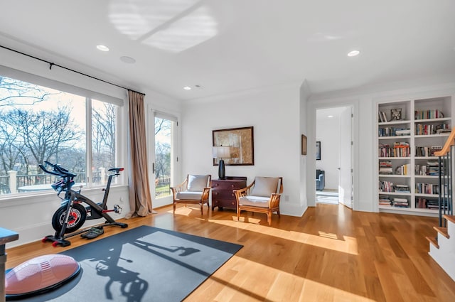 workout area with recessed lighting, wood finished floors, and baseboards