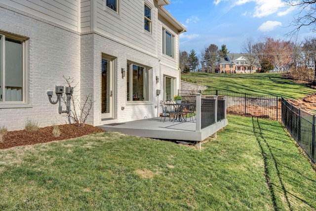 view of yard with a deck and a fenced backyard