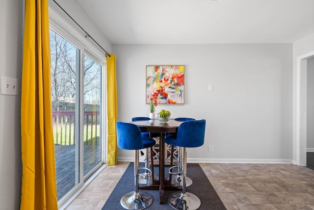 dining space with baseboards