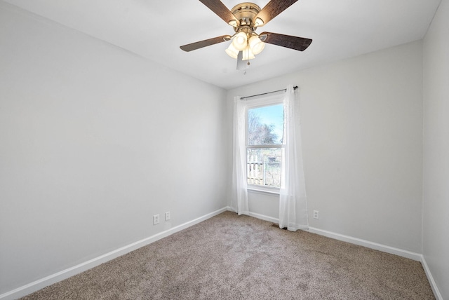 unfurnished room featuring light carpet, ceiling fan, and baseboards