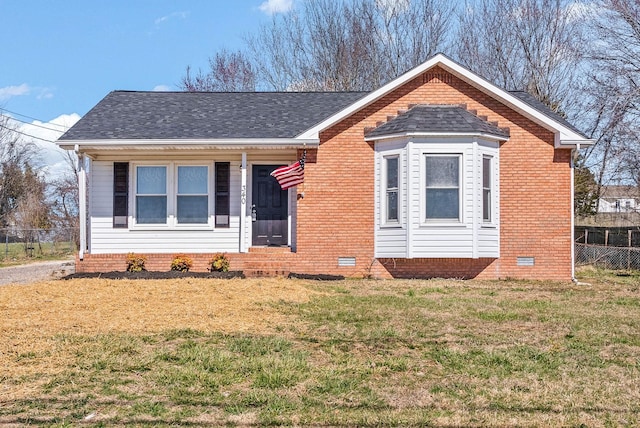 view of front of property with crawl space, roof with shingles, a front lawn, and fence