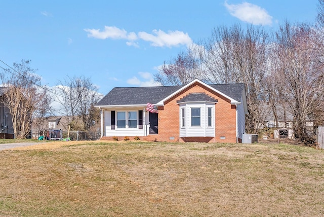 bungalow featuring crawl space, central AC unit, a front yard, and a shingled roof