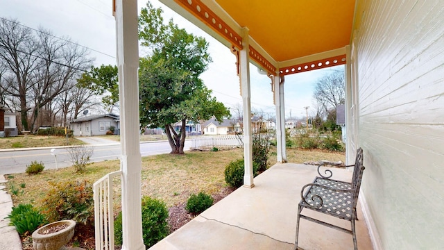 view of patio with covered porch and a residential view