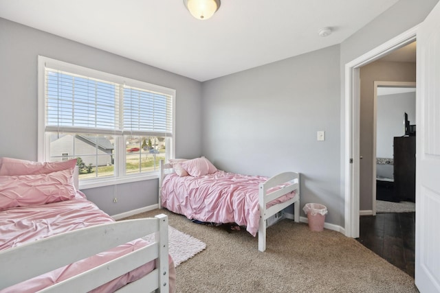 carpeted bedroom with baseboards