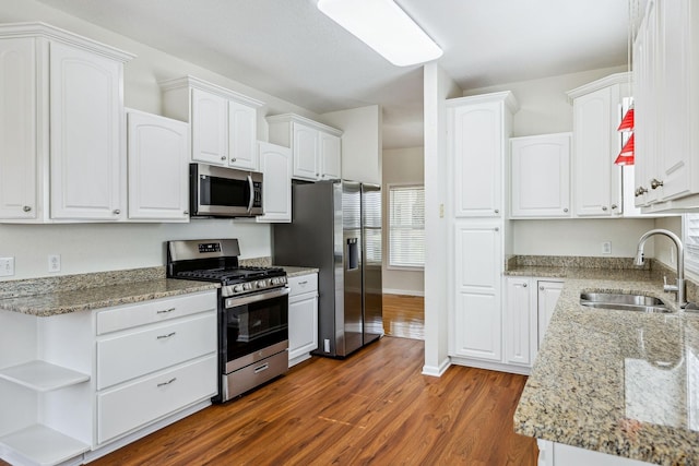 334 Idaho Springs Rd, Clarksville, TN 37043 - kitchen with a sink, light stone countertops, appliances with stainless steel finishes, and white cabinetry