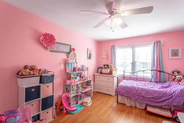 bedroom featuring a ceiling fan and wood finished floors