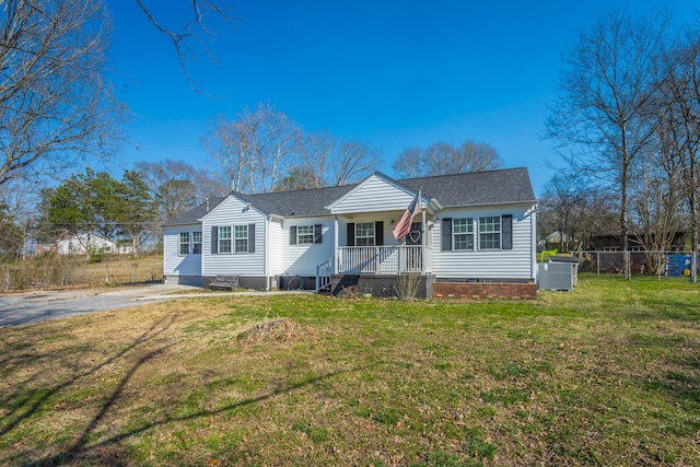 bungalow featuring central air condition unit, a front lawn, fence, a shingled roof, and crawl space