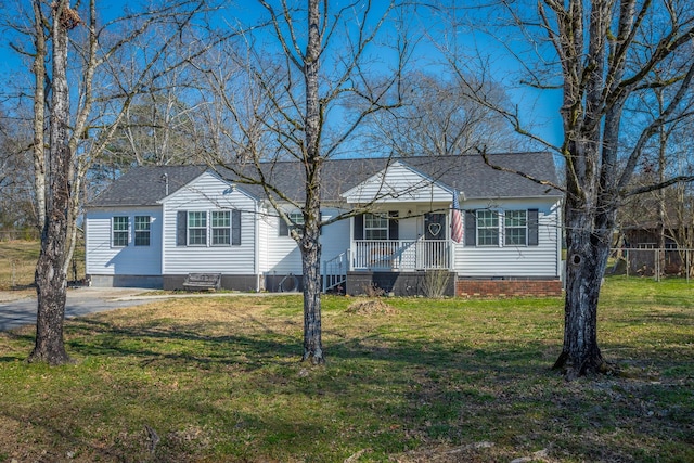 view of front of property with crawl space, covered porch, a front lawn, and a shingled roof