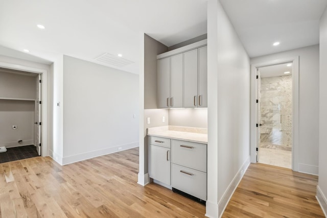 interior space with recessed lighting, light countertops, and light wood-style floors