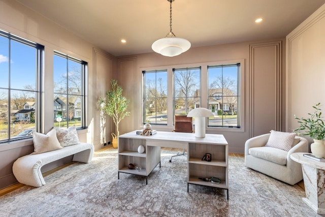 office space featuring a wealth of natural light, recessed lighting, and wood finished floors