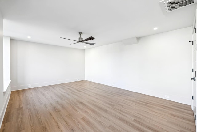 spare room featuring baseboards, visible vents, light wood-style flooring, recessed lighting, and ceiling fan