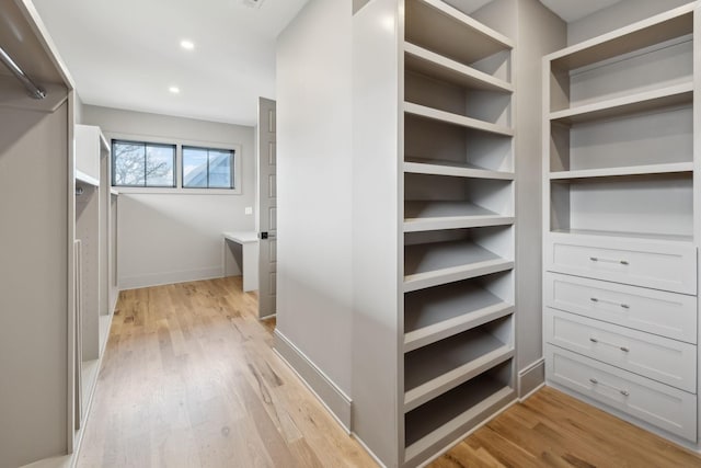 spacious closet with light wood finished floors