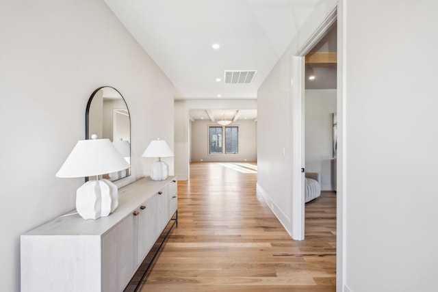 corridor featuring recessed lighting, baseboards, visible vents, and light wood finished floors