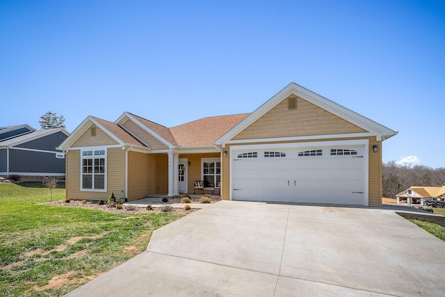 view of front of house with concrete driveway, an attached garage, and a front lawn