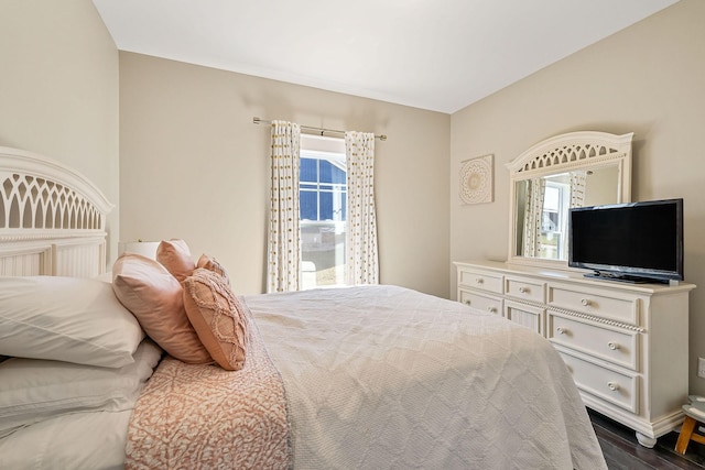 bedroom featuring dark wood-style flooring