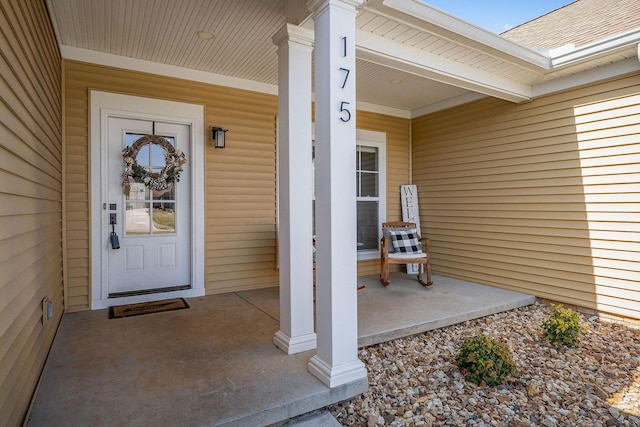 doorway to property with covered porch