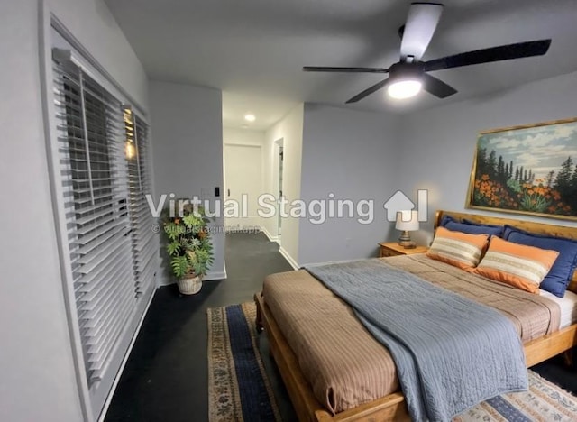 bedroom with a ceiling fan and baseboards