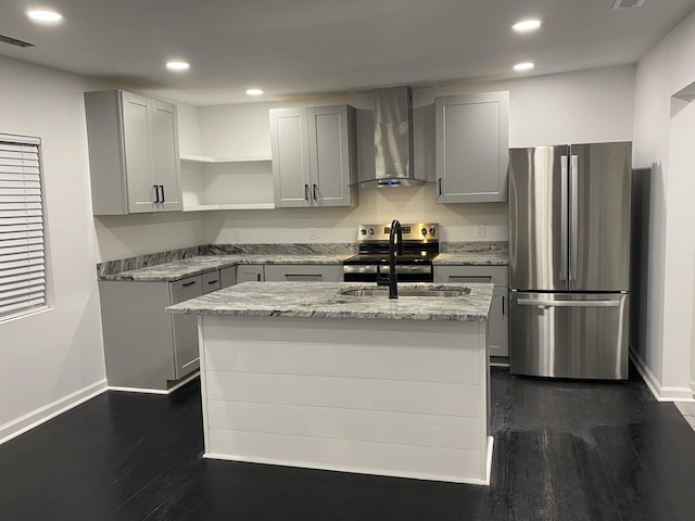 kitchen featuring gray cabinets, stainless steel appliances, wall chimney range hood, and a sink