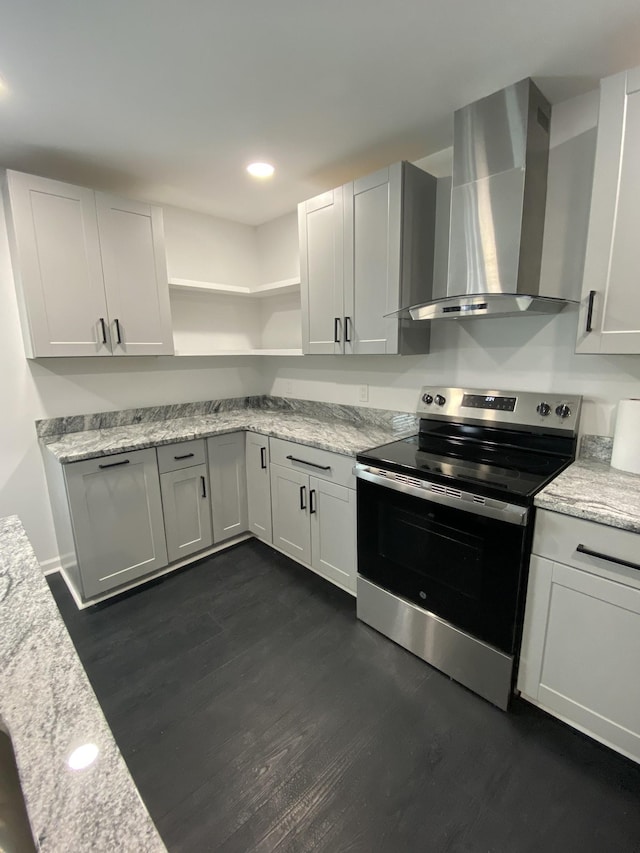 kitchen with dark wood finished floors, stainless steel electric stove, recessed lighting, wall chimney exhaust hood, and open shelves