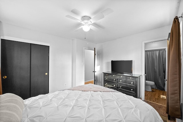 bedroom with ensuite bathroom and a ceiling fan