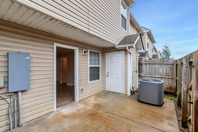 view of patio / terrace with cooling unit and a fenced backyard