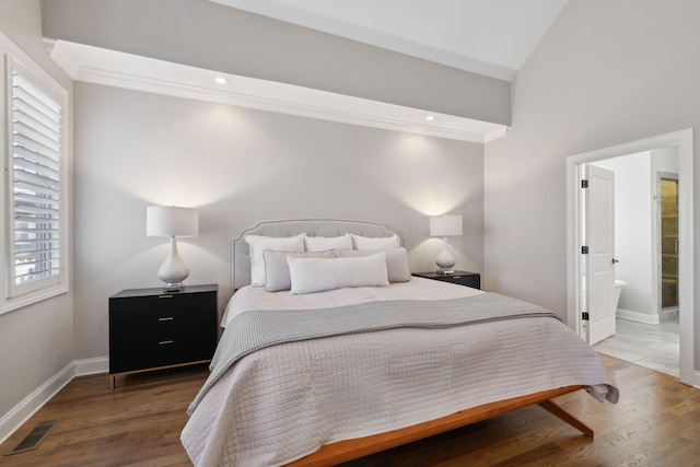 bedroom with visible vents, ornamental molding, baseboards, and wood finished floors