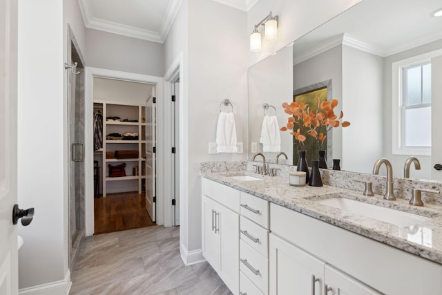 full bathroom with a spacious closet, ornamental molding, and a sink