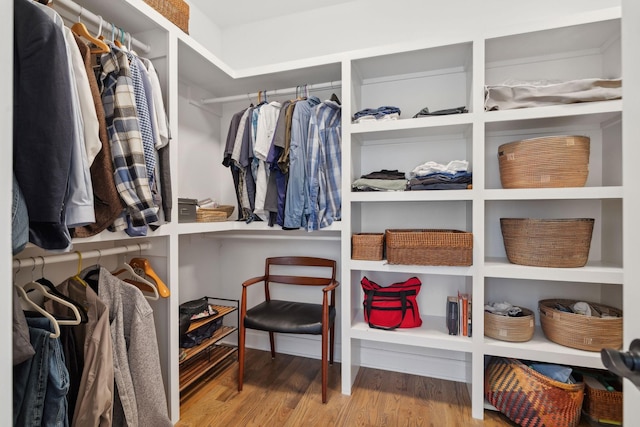 spacious closet with wood finished floors