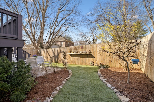 view of yard featuring a patio area and a fenced backyard